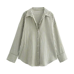 Detailed view of a striped satin-finish blouse with elegant green vertical patterns.