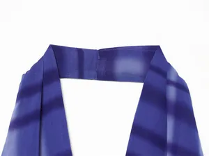 Close-up view of a purple gradient printed chiffon halter neck strap with fine stitching