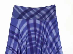 Close-up detail of blue and purple plaid chiffon flared skirt showing waist and print