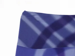 Close-up of purple gradient check pattern on lightweight chiffon fabric.