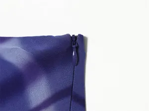 Close-up view showing the concealed side zipper on a purple printed chiffon fabric