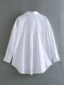 Detailed back view of white satin texture long-sleeve blouse with pleated back yoke