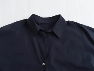 Detailed close-up view of navy blue satin shirt collar with smooth fabric texture