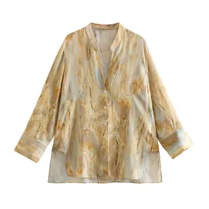 Detailed macro view of tie-dye silk satin shirt featuring elegant mandarin collar design.