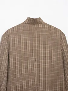 Close-up detail of the back collar and shoulder of a brown plaid women's blazer
