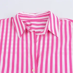 Close-up detail of the lapel collar on a stylish pink and white striped shirt.