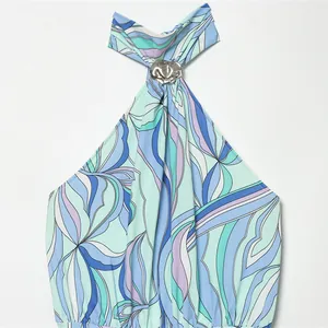 Halter neck mini dress with abstract blue wavy print and silver metal buckle accent