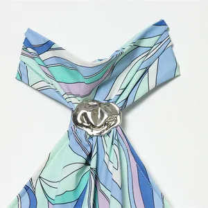 Abstract blue and green print halter neck mini dress with silver metallic buckle detail