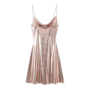 Elegant metallic rose gold slip dress with spaghetti straps and low back design.