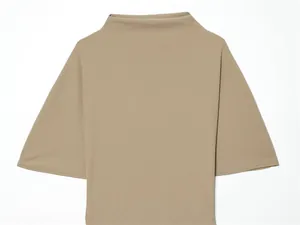 Detail shot of khaki mock neck top showing fine fabric texture and wide sleeve design