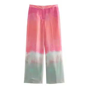 Detailed view of women's gradient tie-dye satin straight-leg trousers in pink and green