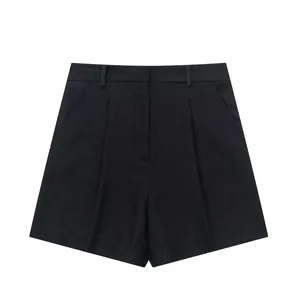 Detailed macro view of women's black linen blend high-waisted pleated summer shorts