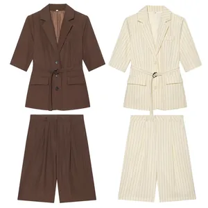 Detailed view of two-piece linen blazer and shorts set in solid brown and striped beige