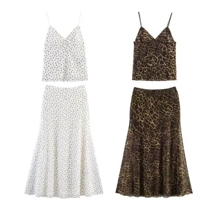 Detail showing elegant two-piece mesh sets in classic polka dot and leopard print designs