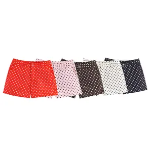 Detailed view of high-waisted polka dot shorts in various color options