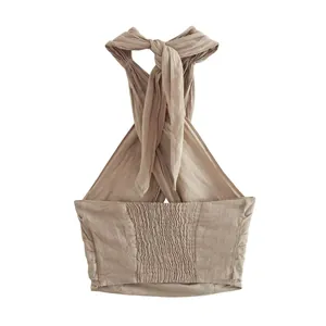 Back view of a khaki linen halter top featuring a smocked elastic panel and tie neck