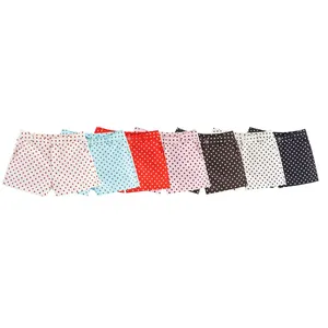 Row of vibrant colorful summer polka dot shorts in various colors for casual summer wear