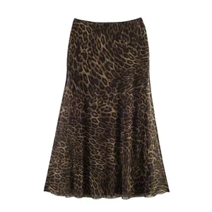 Detail of leopard print mesh midi skirt with elegant high-waisted A-line silhouette