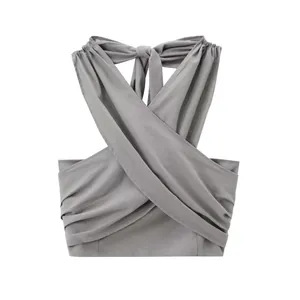 Close-up detail of a minimalist grey halter neck linen wrap top for summer wear