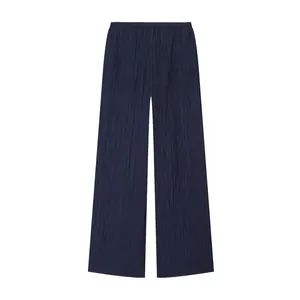 Detailed front view of dark navy pleated wide-leg trousers with crinkle fabric