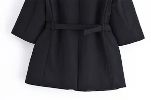 Detailed view of back waist and belt on black linen blend blazer with 5-point sleeves.