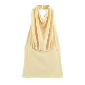 Elegant light yellow halter neck top with draped cowl neck and pleated waist detail