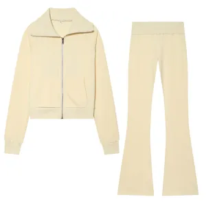 Cream two-piece fleece set including a zip-up jacket and high waist flare pants