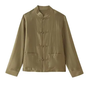 Detailed view of the elegant olive green silky shirt with traditional knot buttons