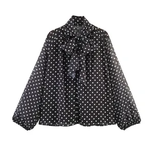Elegant black polka dot long sleeve blouse featuring a stylish oversized pussy-bow tie-neck