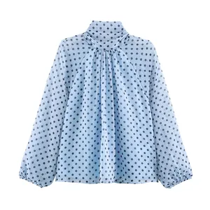 Elegant light blue long sleeve blouse with classic black polka dots and high neck