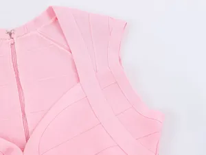Close-up detail of a pink elastic bandage knit top showing zipper and fabric texture