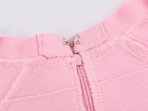 Close-up showing the hidden zipper and hook closure detail on this pink knit tank top.