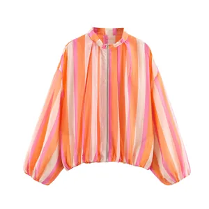 Detail view of the colorful vertical stripes and zip-up front on this lightweight summer jacket.