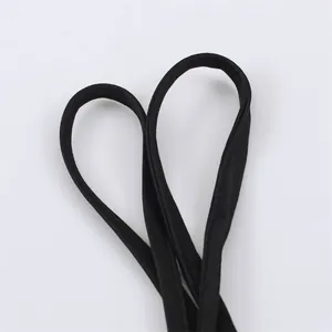 Close-up view of black shoulder straps showing detailed stitching on a fashion dress