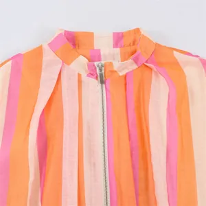 Detailed view of striped casual jacket featuring collar and silver-tone zipper closure