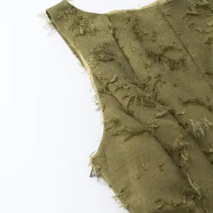Close-up detail of khaki fringe jacquard fabric showing intricate tassel texture