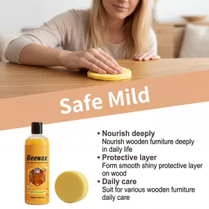 Detail view of applying beeswax furniture polish on a light wood tabletop.