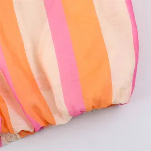 Macro view of colorful striped fabric and elastic cuff detail on a casual jacket