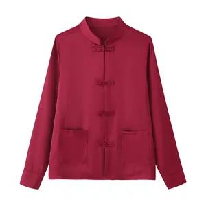 Burgundy long sleeve blouse featuring traditional Chinese knot buttons and front pockets.
