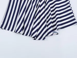 Close-up detail of blue and white striped asymmetrical hem for summer vacation skirt