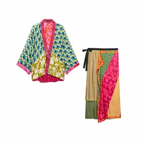 Elegant floral print kimono jacket and matching wrap skirt set shown on white background
