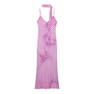 Pink polka dot summer slip dress with matching necktie detail on white background