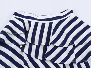 Close-up detail of tiered blue and white striped ruffles on asymmetric vacation skirt