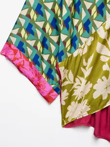 Close-up of vibrant geometric and floral print patchwork fabric for elegant summer wear