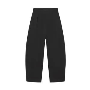 High-waist black balloon trousers with front pleats and loose tapered leg cut.