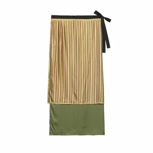 Detail view of stylish olive green striped long skirt with waist ribbon tie