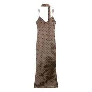 Detailed view of a vintage slim-fit polka dot slip dress with a unique tie-dye effect