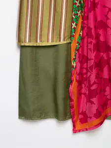 Detail view of floral print and olive green satin fabric textures for women attire