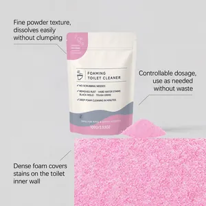 Close-up macro view of the pink foaming toilet cleaner powder texture and packaging