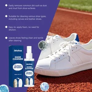 Detail view of Jakehoe shoe cleaner spray with white sneakers on a running track
